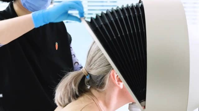 Skin analysis consultation with clinic equipment